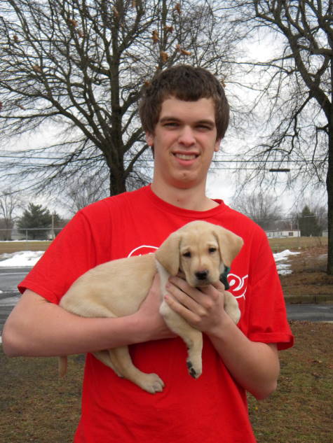 Puppy Power 4-H Club member Michael Lucchesi of Vineland is seen holding his new 4-H Seeing Eye puppy.