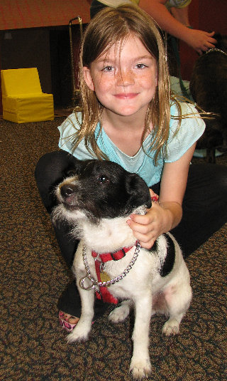 Caitlyn Crawford (below), Millville, age 8, answered questions about caring for Patches, a terrier mix. 